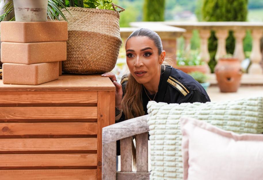 GK Barry peeking out from behind a wooden structure.