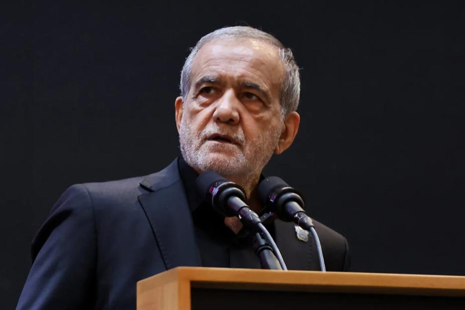 Iranian President Masoud Pezeshkian speaking at a conference.