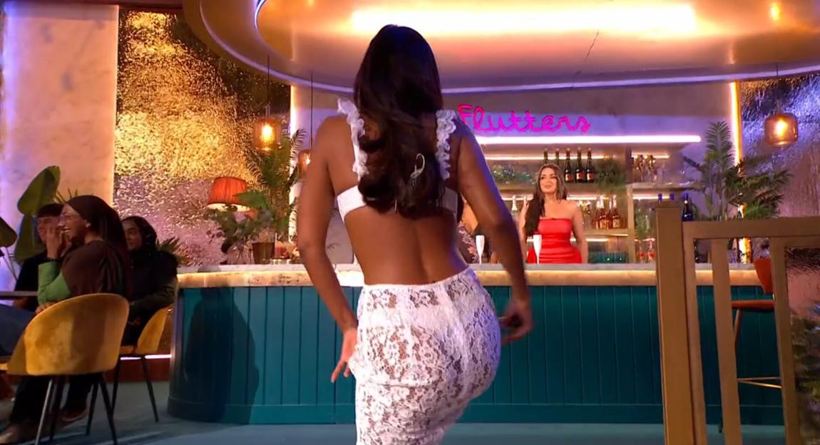 Maya Jama in a see-through lace dress on Aftersun.