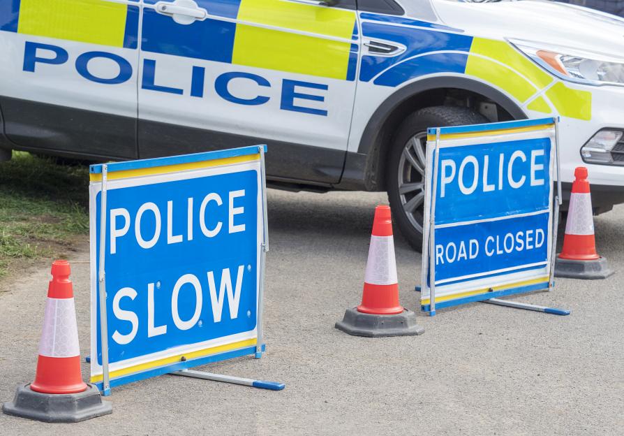 Police Car and Warning Signs