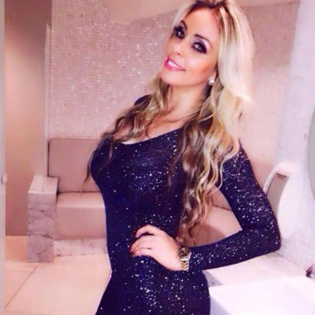 A businesswoman, who died after a six-in-one cosmetic surgery, smiles at the camera.
