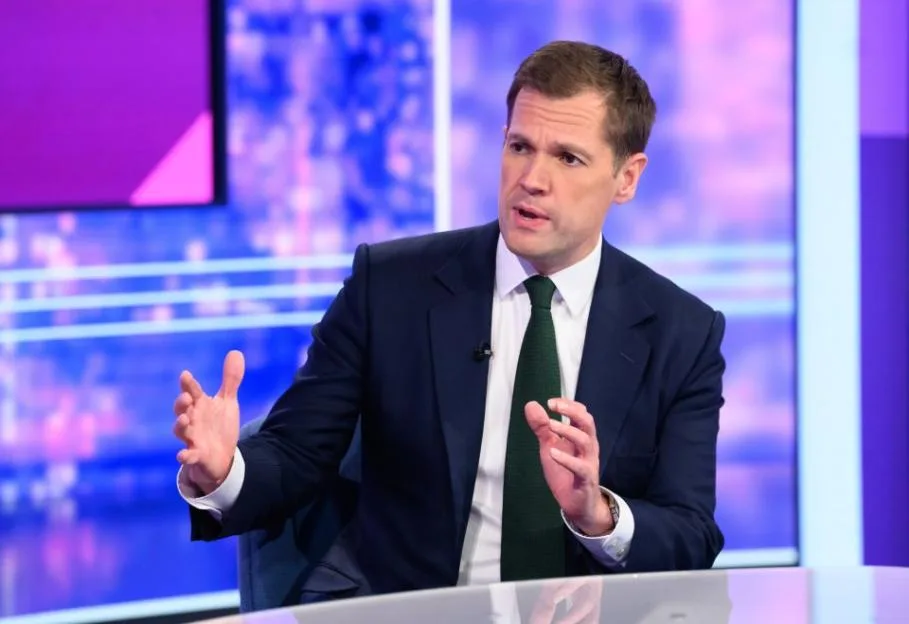 Robert Jenrick appears on the 'Peston' TV show, speaking and gesturing with his hands.