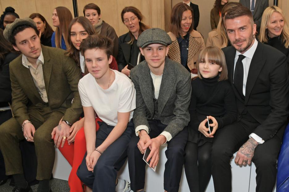 Brooklyn Beckham, Hana Cross, Cruz Beckham, Romeo Beckham, Harper Beckham, and David Beckham in the front row of the Victoria Beckham show during London Fashion Week.