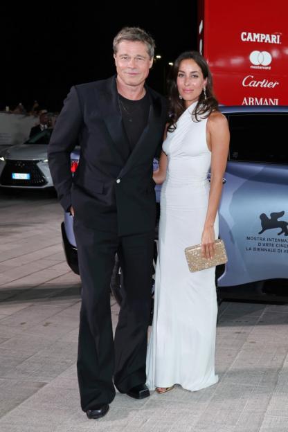 Brad Pitt and Ines de Ramon posing together at an event.