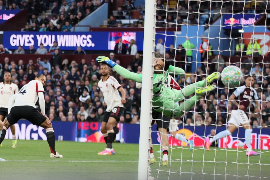 Giorgi Mamardashvili, the goalkeeper of Liverpool is beaten as Morgan Rogers of Aston Villa (r) scores his teams 1st goal. Premier League match, Aston Villa v Liverpool at Villa Park in Birmingham on Friday 15th May 2026. this image may only be used