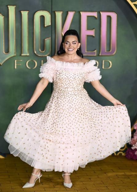 Scarlett Moffatt in a pale pink, off-the-shoulder, sequined gown, posing at the "Wicked: For Good" premiere.
