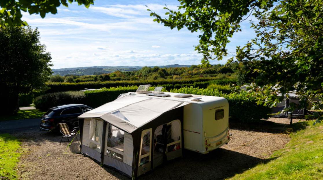 Caravan and awning at Lickpenny Matlock Club Campsite.