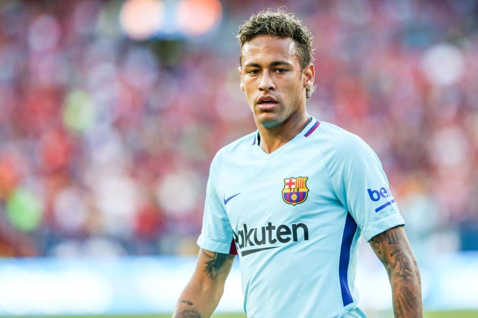 Neymar Jr. looking forward in a light blue Barcelona jersey during a football match.
