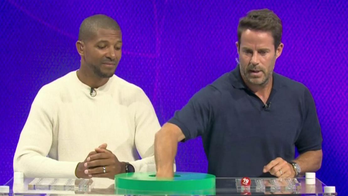 Two men conducting a sports draw.