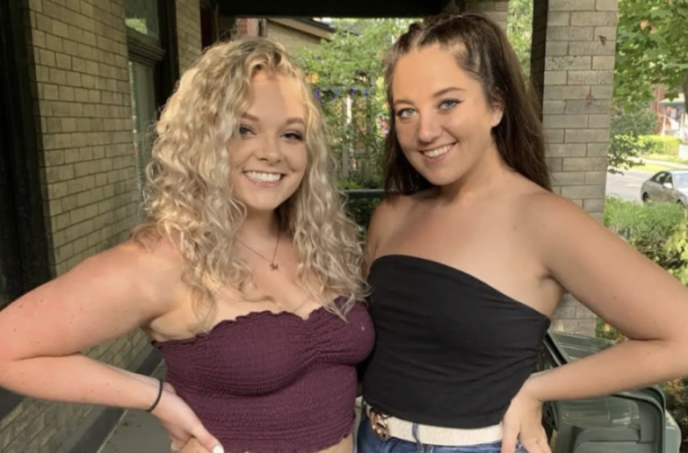 Two smiling women posing for a picture.