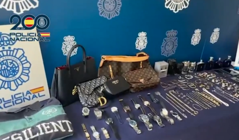 Bags, watches, jewelry, and perfumes seized from burglary gangs by the Spanish National Police.