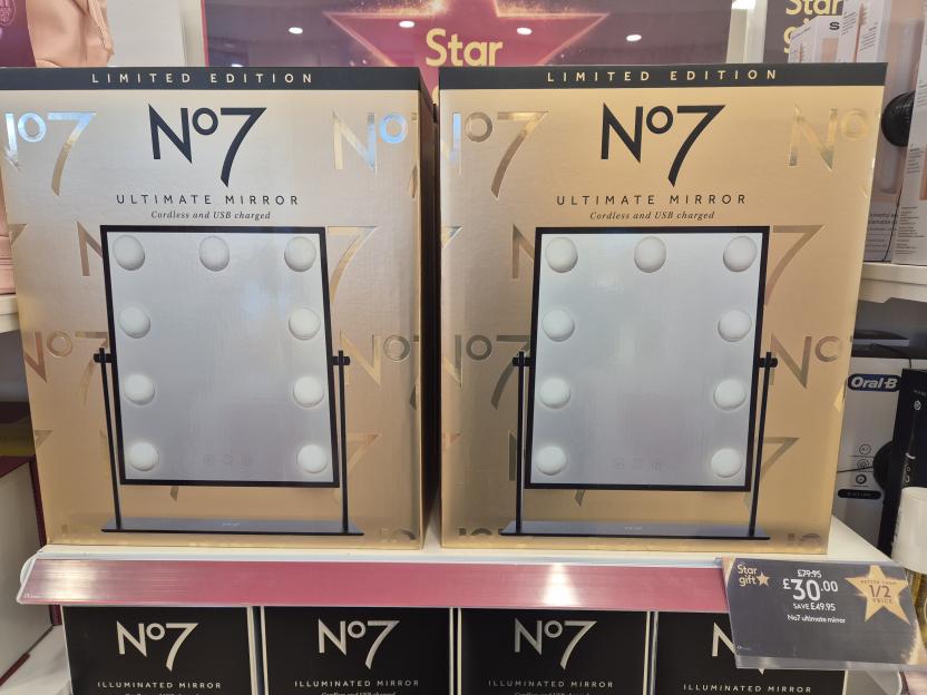 Two "No7 Limited Edition Ultimate Mirror" boxes are on display with a promotional tag.