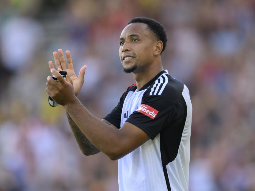 Fulham's Kenny Tete applauds the fans.