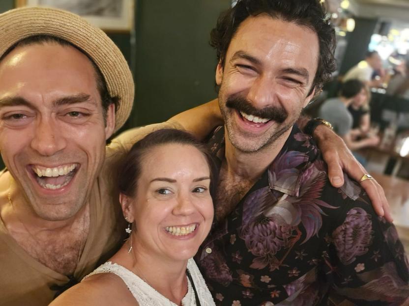 Selfie of three Rivals cast members laughing.