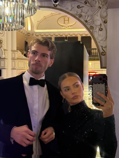 Livvy and Joel Evans posing for a photo.