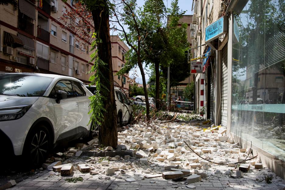 Debris from a building lies scattered on a street after an earthquake in Granada, Spain.