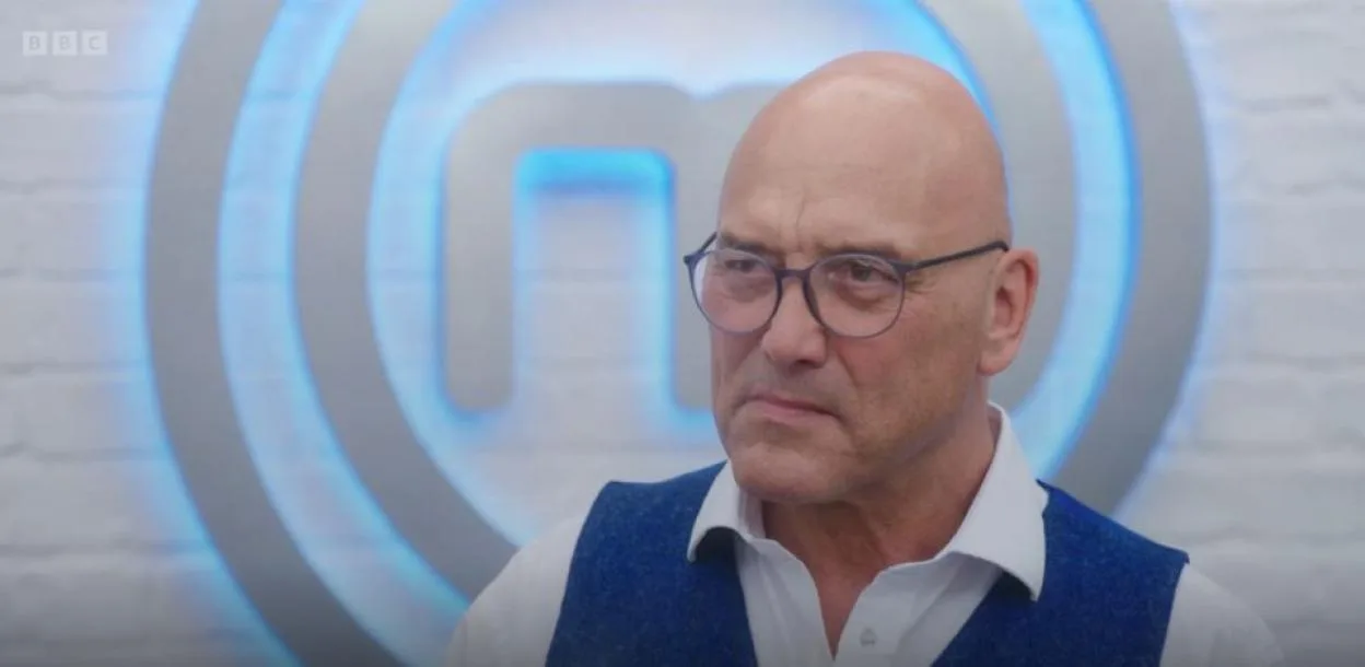 Masterchef series 21, Episode 2, featuring a bald man in glasses and a blue vest.