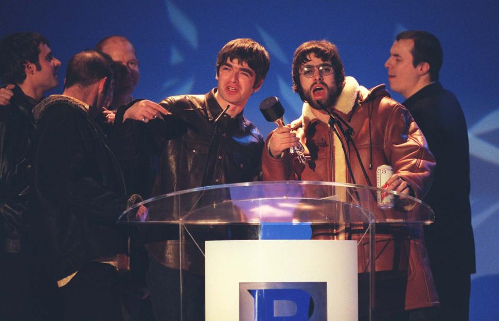 Noel and Liam Gallagher of Oasis accepting an award.