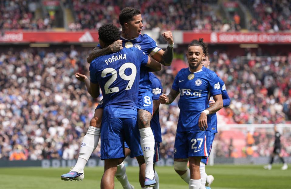 Enzo Fernandez celebrates a goal for Chelsea while being embraced by Wesley Fofana.