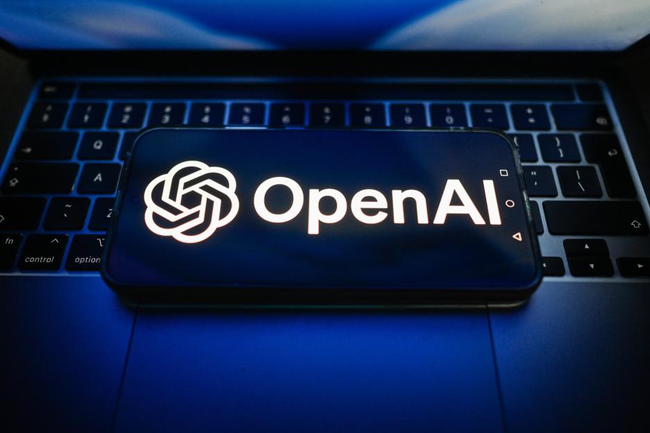 In this photo illustration, an OpenAI logo is seen displayed