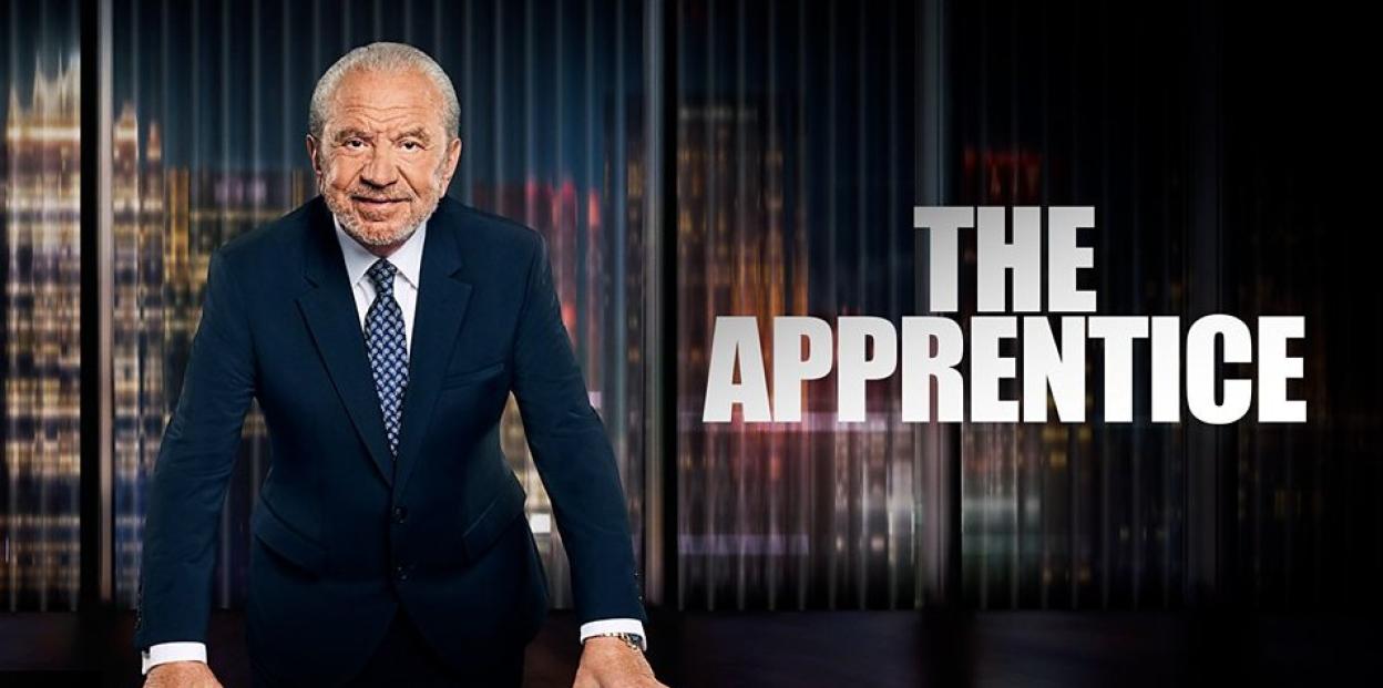 Lord Sugar in a suit and tie for "The Apprentice."