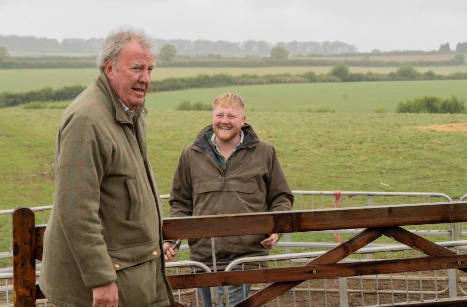 Jeremy Clarkson and Caleb Cooper on a farm.