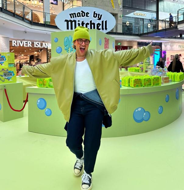 Mitchell Halliday at a Made by Mitchell display in a shopping center.