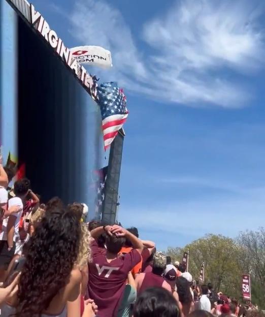 Parachutist's Harrowing Crash into Scoreboard Leaves Him Dangling for Nearly an Hour, Prompting Dramatic Rescue Operation