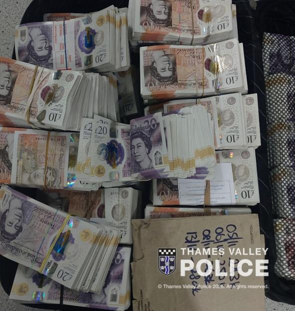 Bundles of British £10 and £20 notes, likely proceeds from drug sales, with "THAMES VALLEY POLICE" watermark.