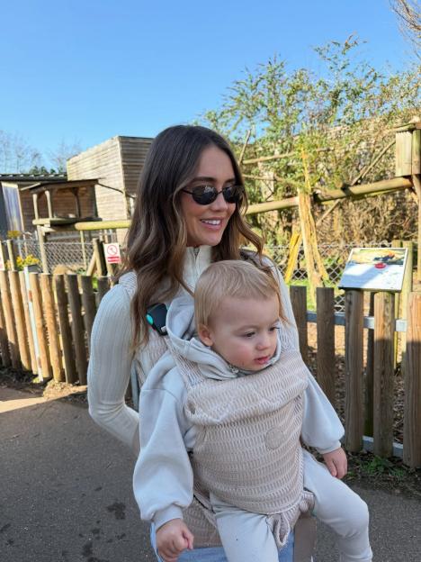 Jake Quickenden's wife and son are seen in a baby carrier on a walk.