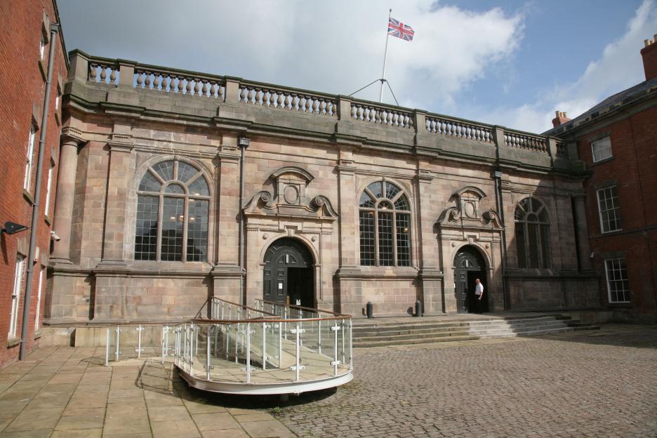 Derby Crown Court at St Mary's Gate with a British flag flying on its roof.