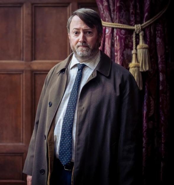 David Mitchell as John "Ludwig" Taylor in the TV show "Ludwig".