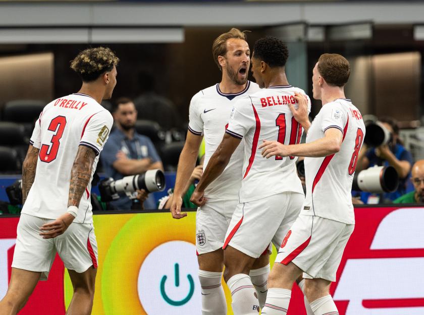 England's Harry Kane celebrating his goal with teammates Jude Bellingham, Elliot Anderson, and Nico O'Reilly during the FIFA World Cup 2026 match.