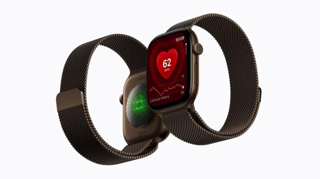 Two Apple Watches with brown Milanese loop bands, showing the front display with a heart rate of 62 BPM and the back sensor.