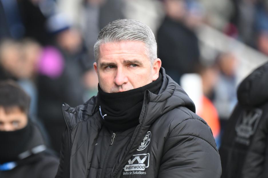 Wigan Parts Ways with Manager Following 6-1 Defeat to Peterborough, Welcomes Premier League Legend as Replacement