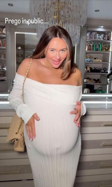 Pregnant woman in a white dress.