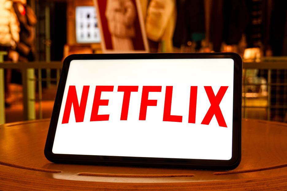 In this photo illustration, a Netflix logo is seen