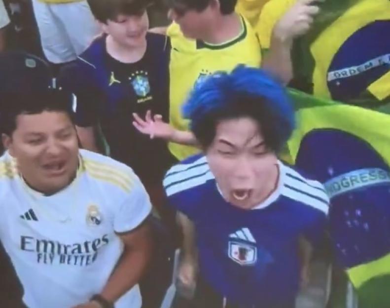 'Heartbroken Japan Fan Goes Viral: Epic Moment as He Rips Off His Jacket While Rival Fans Drape a Brazil Flag Over Him'