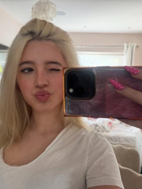 Katherine Ryan's daughter, Violet, winking and pouting in a selfie.