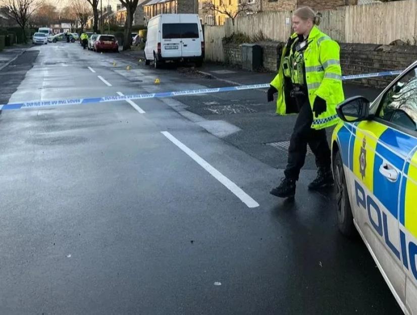 Police at the scene of an attempted murder in Huddersfield.