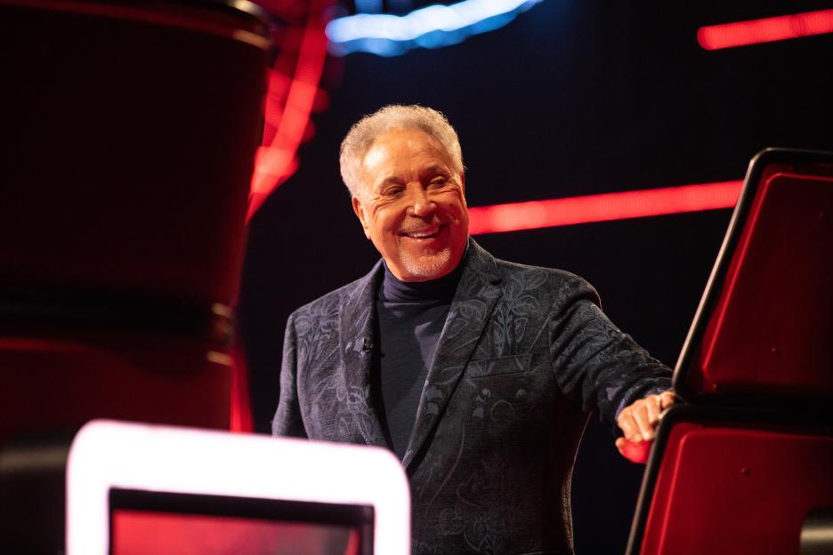 Sir Tom Jones smiling while on the set of The Voice UK.