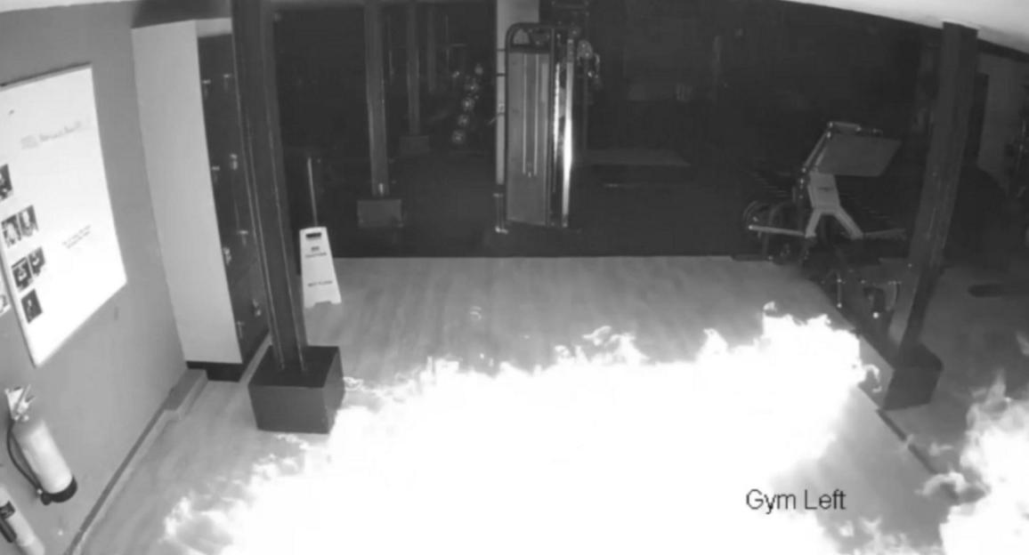 Security footage showing a gym floor engulfed in flames.