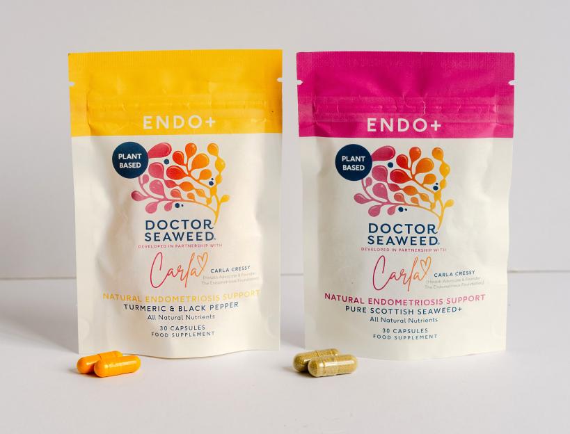 Two pouches of Doctor Seaweed Endo+ supplements, one yellow for Turmeric & Black Pepper and one pink for Pure Scottish Seaweed+, with capsules spilled in front of each.