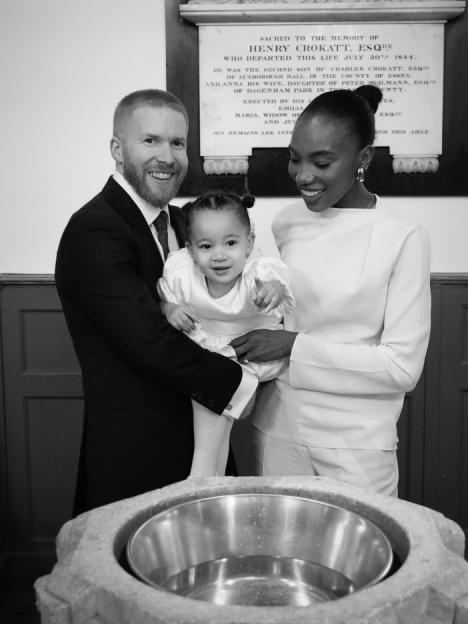 Family baptism moment