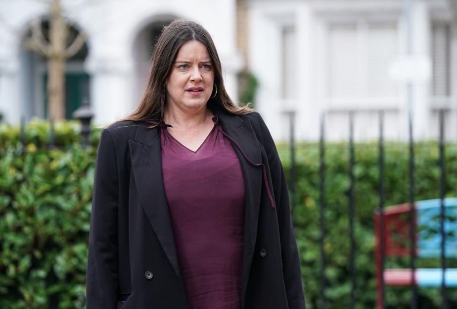 Michelle Ryan as Zoe Slater, looking concerned.