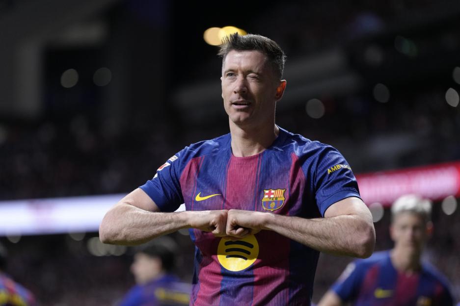 FC Barcelona player Robert Lewandowski celebrates a goal.