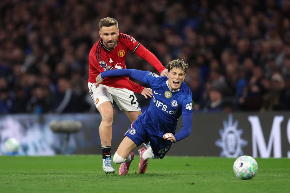 Luke Shaw of Manchester United pushes Alejandro Garnacho of Chelsea.