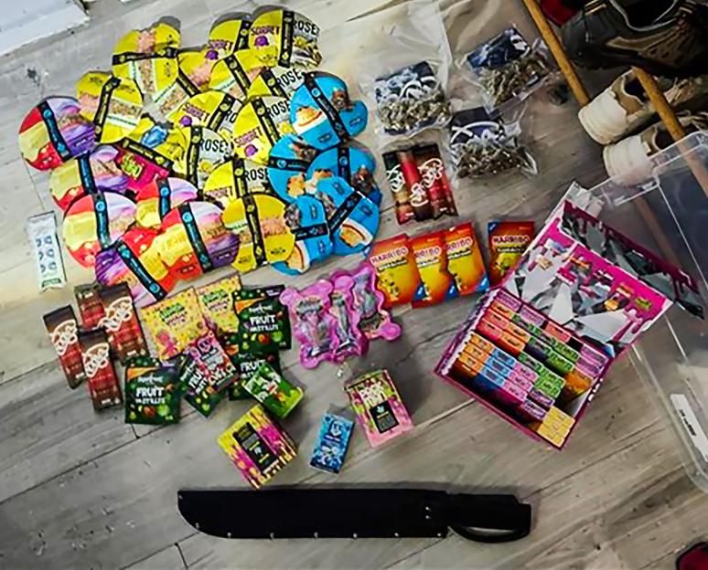 Drugs with child-targeting packaging, and a machete recovered by police.
