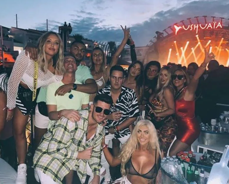 Geordie Shore cast members Charlotte Crosby, Holly Hagan, Sophie Kassei, and Chloe Ferry posing at an outdoor party event.