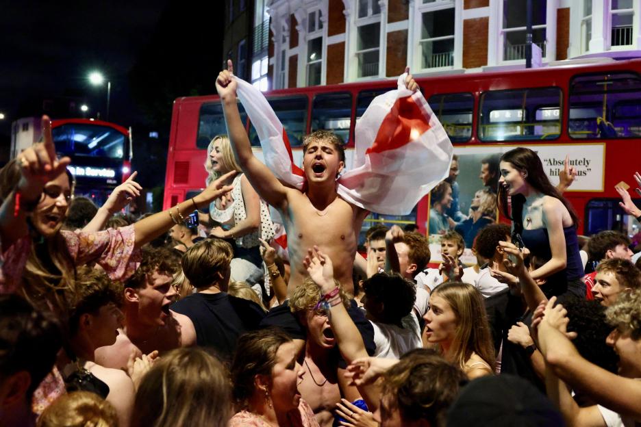 England fans celebrate in the streets of London after their World Cup quarter-final win.